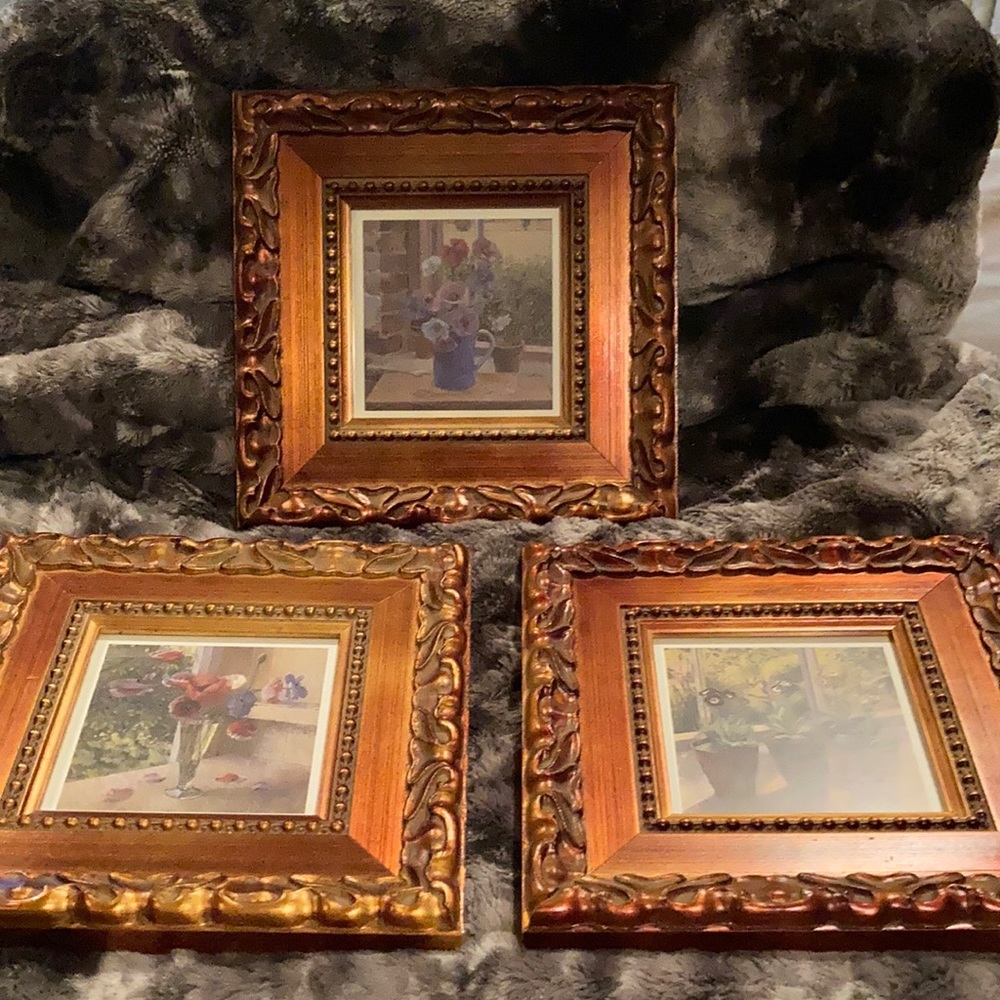 3 flower prints.  Matching frames.